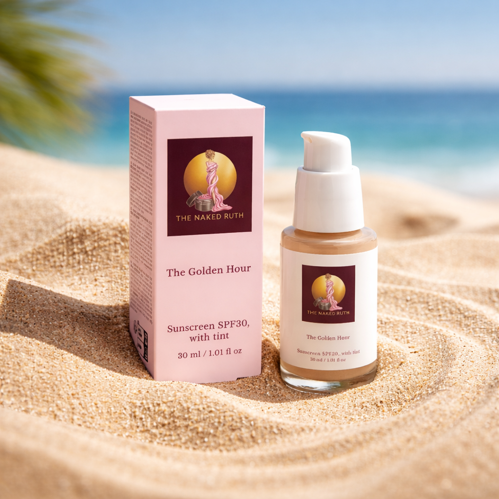 Sunscreen bottle and packaging on sand with ocean background